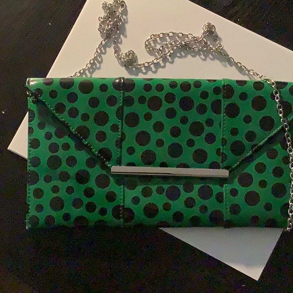 Green and black polka dot patent leather clutch